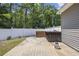 Outdoor deck with a hot tub and wood paneling, perfect for relaxation and backyard entertainment at 197 Black Bear Rd., Myrtle Beach, SC 29588
