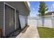 The fenced backyard features a sturdy gate, offering secure access and privacy for outdoor activities at 197 Black Bear Rd., Myrtle Beach, SC 29588