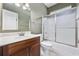 Bathroom featuring a vanity sink, white tile floors, and glass shower doors at 197 Black Bear Rd., Myrtle Beach, SC 29588