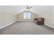 Spacious bonus room with vaulted ceilings, a ceiling fan, and a cozy sofa at 197 Black Bear Rd., Myrtle Beach, SC 29588