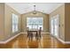 Cozy dining area with wood floors, classic dining set, and a vaulted ceiling at 197 Black Bear Rd., Myrtle Beach, SC 29588