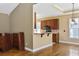 Open-concept kitchen with dark wood cabinetry, counter seating, and hardwood floors at 197 Black Bear Rd., Myrtle Beach, SC 29588