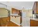 Modern kitchen with tile floors, wood cabinets, and an open layout, perfect for entertaining at 197 Black Bear Rd., Myrtle Beach, SC 29588