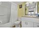Bright bathroom features a shower-tub combo with white shower curtain, and a stylish vanity with attractive faucet at 205 74Th Ave. N # 1508, Myrtle Beach, SC 29572