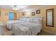 This bedroom features two beds with stylish bedding, light yellow walls, and a ceiling fan for added comfort at 205 74Th Ave. N # 1508, Myrtle Beach, SC 29572