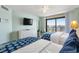 Bedroom featuring two beds, dresser, and an outdoor view at 205 74Th Ave. N # 1508, Myrtle Beach, SC 29572