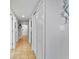 Clean hallway featuring a sliding door closet and bright lighting, offering convenient storage space for residents at 205 74Th Ave. N # 1508, Myrtle Beach, SC 29572