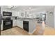 Open kitchen flows into living area with stainless appliances, granite countertops, and views from the sliding glass doors at 205 74Th Ave. N # 1508, Myrtle Beach, SC 29572
