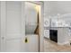 A stacked washer and dryer are situated in a closet near the kitchen at 205 74Th Ave. N # 1508, Myrtle Beach, SC 29572