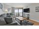 Comfortable living room features a large sliding glass door to a balcony and ocean views at 205 74Th Ave. N # 1508, Myrtle Beach, SC 29572