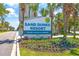 Well-maintained Sand Dunes Resort sign with colorful landscaping at 205 74Th Ave. N # 1508, Myrtle Beach, SC 29572