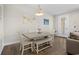 Dining area with a modern table, chairs, and view into the backyard at 2204 Tidewatch Way # 2204, North Myrtle Beach, SC 29582