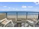 Enjoy the ocean view from this cozy balcony with comfortable chairs and a small table at 2300 N Ocean Blvd. # 1037, Myrtle Beach, SC 29577