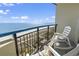 Relaxing balcony with rocking chairs overlooking the beach, perfect for enjoying the ocean breeze at 2300 N Ocean Blvd. # 1037, Myrtle Beach, SC 29577