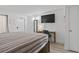 Bright bedroom featuring a desk, television, and comfortable bed for a relaxing retreat at 2300 N Ocean Blvd. # 1037, Myrtle Beach, SC 29577