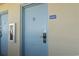 Exterior view of unit number 1037; door is light blue with a lockbox and no smoking symbol at 2300 N Ocean Blvd. # 1037, Myrtle Beach, SC 29577