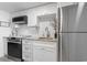 Charming kitchen with white cabinetry, stainless steel appliances, and modern finishes throughout at 2300 N Ocean Blvd. # 1037, Myrtle Beach, SC 29577