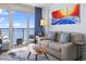 Bright living room featuring a water view, hardwood floors, and cozy seating at 2300 N Ocean Blvd. # 1037, Myrtle Beach, SC 29577