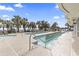 Inviting outdoor pool area with palm trees and lounge chairs at 2300 N Ocean Blvd. # 1037, Myrtle Beach, SC 29577
