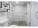 Elegant bathroom with a glass-enclosed shower featuring marble tile and a mosaic floor at 2300 N Ocean Blvd. # 1037, Myrtle Beach, SC 29577