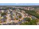 An aerial view of a residential neighborhood with winding streets, lush landscaping, and a pond at 2350 Clandon Dr., Myrtle Beach, SC 29579