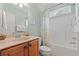 This bathroom features a single sink vanity, large mirror, and a shower/tub combo with curtain at 2350 Clandon Dr., Myrtle Beach, SC 29579
