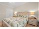 The bedroom features a bright window, ceiling fan and matching bedside tables and dresser at 2350 Clandon Dr., Myrtle Beach, SC 29579