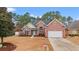 Charming two-story brick home with a well-manicured front yard and attached two-car garage at 2350 Clandon Dr., Myrtle Beach, SC 29579