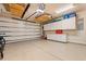 Organized garage features epoxy floors, storage cabinets, and overhead racks for efficient storage at 2350 Clandon Dr., Myrtle Beach, SC 29579