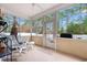 Relaxing screened porch with rocking chairs and views of the private backyard at 2350 Clandon Dr., Myrtle Beach, SC 29579