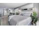 Relaxing bedroom with a king-size bed, decorative pillows, and a view of the living area at 2401 S Ocean Blvd. # 1260, Myrtle Beach, SC 29577