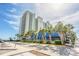Beautiful exterior view of a multi-story building surrounded by landscaped palms against a clear sky at 2401 S Ocean Blvd. # 1260, Myrtle Beach, SC 29577