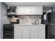 Well-equipped kitchen featuring modern white cabinets and black appliances at 2401 S Ocean Blvd. # 1260, Myrtle Beach, SC 29577