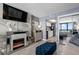 Cozy living room featuring a modern fireplace and a glimpse into the fully-equipped kitchen area at 2401 S Ocean Blvd. # 1260, Myrtle Beach, SC 29577