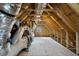 Unfinished attic space, featuring exposed beams and a small window at 2416 Campton Loop, Conway, SC 29527