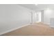 Bright bedroom featuring neutral carpeting, base trim, and a light-filled view at 2416 Campton Loop, Conway, SC 29527
