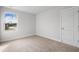 Bright bedroom featuring neutral carpeting and a window with neighborhood views at 2416 Campton Loop, Conway, SC 29527