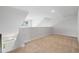 Open loft area featuring neutral carpeting, natural light, and views of the downstairs entryway at 2416 Campton Loop, Conway, SC 29527