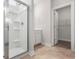 Bathroom showcasing a glass-enclosed shower, vanity, and walk-in closet at 2420 Campton Loop, Conway, SC 29527