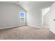 Neutral carpeted bedroom featuring an attic ceiling and natural light from a single window at 2420 Campton Loop, Conway, SC 29527