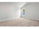 Freshly painted and carpeted bedroom featuring an attic ceiling and natural light from a single window at 2420 Campton Loop, Conway, SC 29527