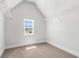 Walk-in closet with carpet, white wire shelving, natural light from a window, and fresh white paint at 2420 Campton Loop, Conway, SC 29527