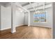 Spacious living room with wood floors, large windows, and a chandelier at 2420 Campton Loop, Conway, SC 29527