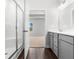 Bright bathroom featuring a glass shower and grey cabinets at 2424 Campton Loop, Conway, SC 29527