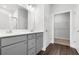 Bathroom featuring double sinks, grey cabinets, and wood look flooring at 2424 Campton Loop, Conway, SC 29527