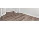 Bedroom with luxury vinyl plank flooring, white trim and walls, and french doors at 2424 Campton Loop, Conway, SC 29527