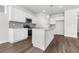 Stylish kitchen featuring white cabinets, gray subway tile backsplash, and wood flooring at 2424 Campton Loop, Conway, SC 29527