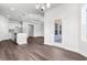 Open-concept kitchen and living area with modern appliances, sleek cabinetry, and stylish wood flooring at 2424 Campton Loop, Conway, SC 29527