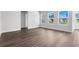 Bright living room with attractive hardwood floors and natural light from multiple windows at 2424 Campton Loop, Conway, SC 29527