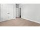 Bedroom featuring neutral carpet, white trim and door, and a spacious closet at 2443 Campton Loop, Conway, SC 29527